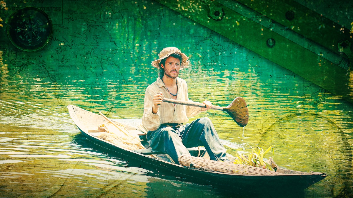 River. A young man in a worn straw hat, a loose beige shirt and blue pants rows in a canoe.