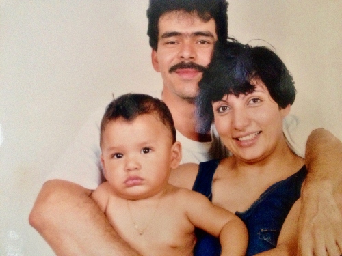 A young Carlos with his family