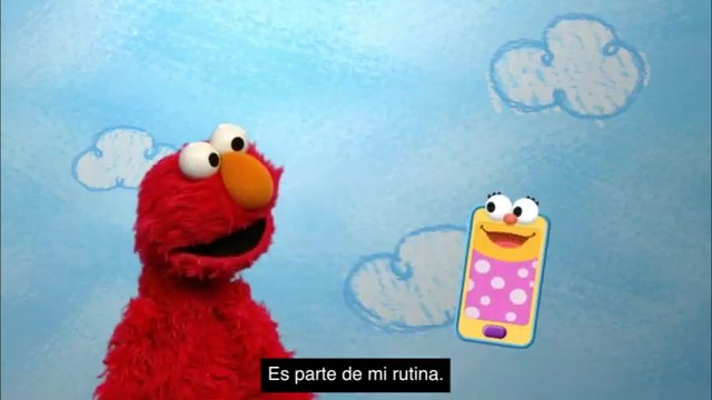 Elmo Talking to a floating smartphone with google eyes and mouth