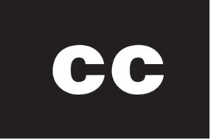 Captioning symbol: Over a black background, the letters 
